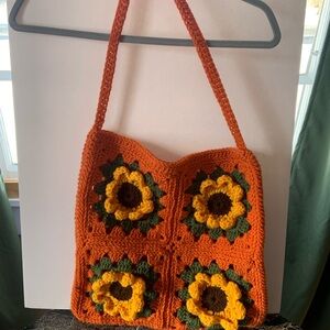 Adorable hand crocheted tote in a sunflower pattern.